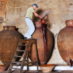 Man making the transfega of the wines of carving